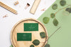 Top View Business Cards On Wood With Plant Psd