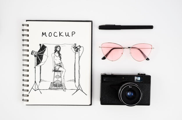 Top View Camera And Notebook Arrangement Psd