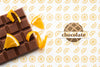 Top View Chocolate With Orange Background Mock-Up Psd