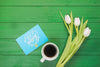 Top View Collection Of Coffee Cup Next To Flowers Psd