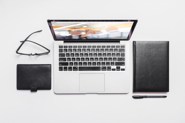 Top View Composition With Laptop And Office Supplies Psd