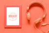 Top View Coral Arrangement With Frame Mock-Up And Headphones Psd
