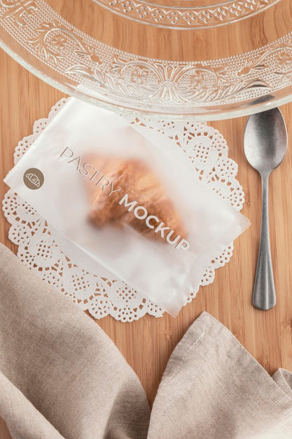 Top View Croissant In Transparent Packaging Psd