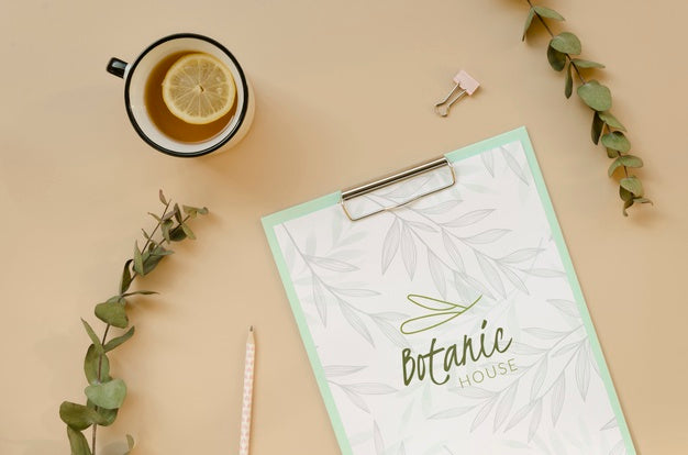 Top View Cup Of Tea With Clipboard On The Table Psd
