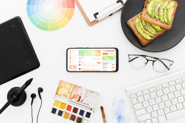 Top View Desk With Avocado Toast And Phone Mock-Up Psd