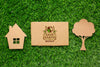Top View Eco Cardboard Mock-Up With Paper House And Tree Psd
