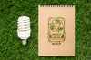 Top View Eco Notebook Mock-Up With Lightbulb Psd