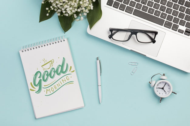 Top View Eyeglasses On Top Of Laptop Psd