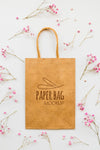 Top View Flowers And Paper Bag Arrangement Psd
