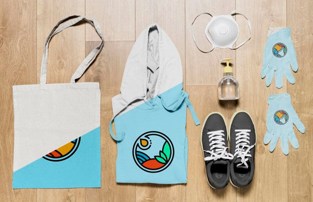 Top View Folded Hoodie Mock-Up With Gloves And Mask Psd