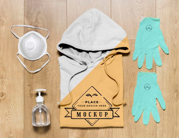 Top View Folded Hoodie Mock-Up With Gloves, Mask And Hand Sanitizer Psd