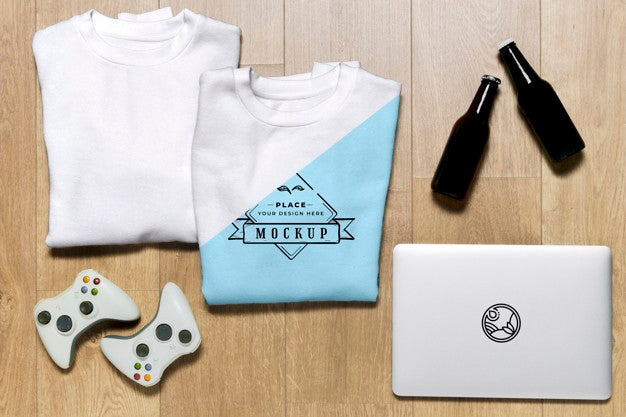 Top View Folded Hoodies Mock-Up With Controllers And Tablet Psd