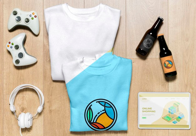Top View Folded Hoodies Mock-Up With Gadgets And Bottles Psd