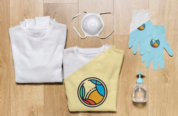 Top View Folded Hoodies Mock-Up With Gloves, Mask And Hand Sanitizer Psd