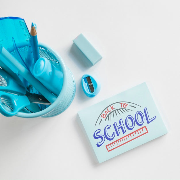 Top View Glass With School Supplies And Eraser Psd