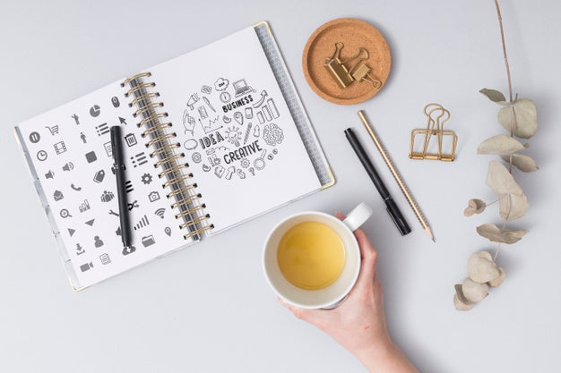 Top View Hand Holding Cup Of Coffee Psd