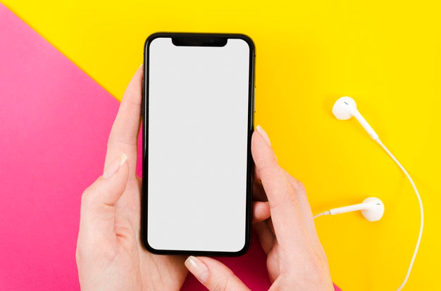 Top View Hands Holding Smartphone Mock-Up With Earphones Psd