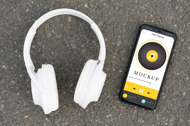 Top View Headphones And Phone Arrangement Psd