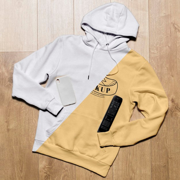 Top View Hoodie Mock-Up With Phone Case And Tv Remote Psd