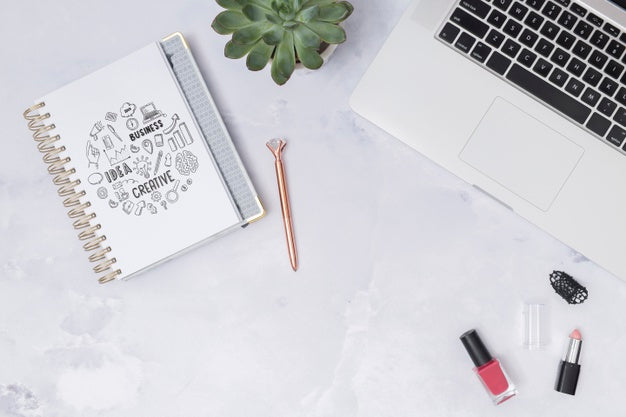 Top View Laptop On A Table With Notepad Psd