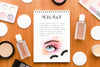 Top View Make-Up Cosmetics Arrangement With Notepad Mock-Up Psd