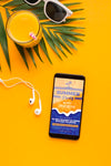 Top View Mobile Phone With Earphones And Orange Juice Psd