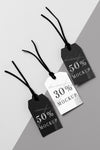 Top View Mock-Up Arrangement Of Black And White Clothing Tags Psd