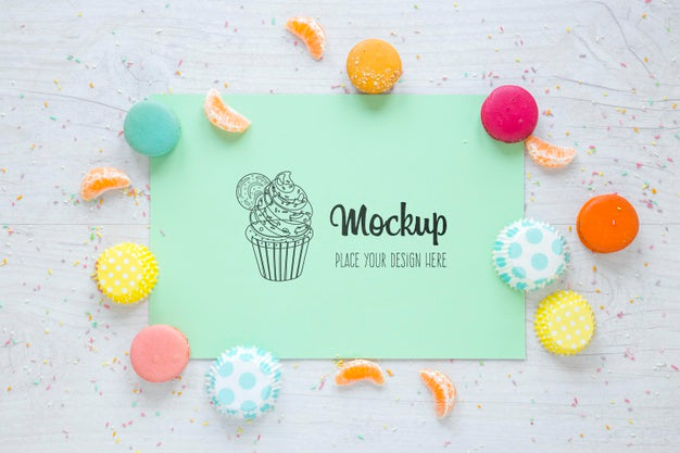Top View Mock-Up With Candies And Orange Slices Psd