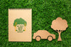 Top View Notebook Mock-Up And Paper Car And Tree Psd