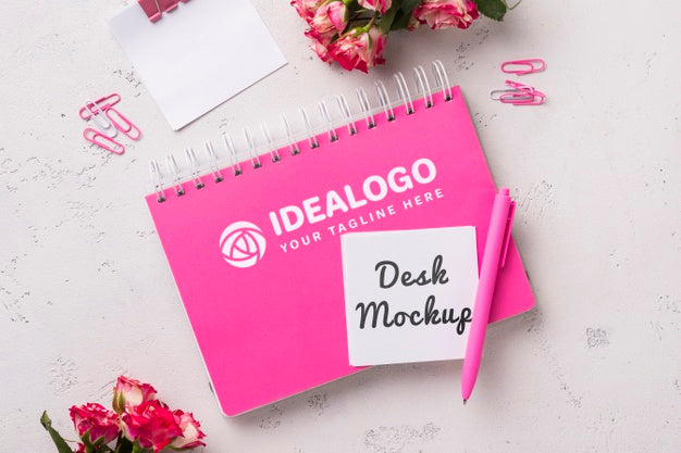 Top View Notebook Mock-Up Near Roses Psd