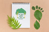 Top View Notebook Mock-Up With Leaves Psd
