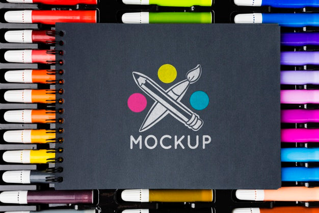 Top View Notebook On Colorful Markers Psd