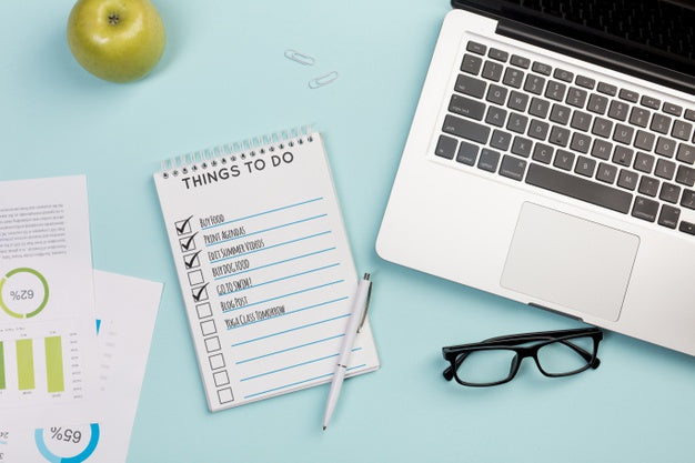 Top View Notebook With Daily Tasks And Laptop Psd