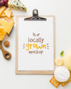 Top View Notepad Mock-Up With Assortment Of Locally Grown Cheese Psd