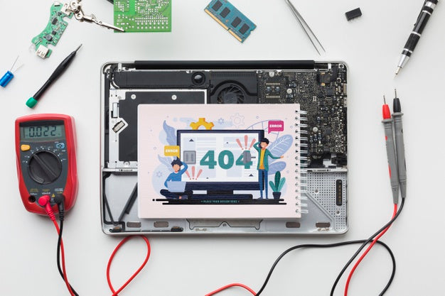 Top View Notepad On A Broken Laptop Psd