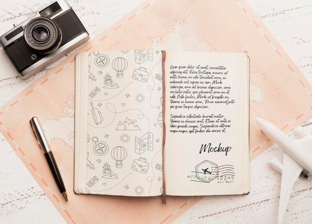 Top View Of Agenda With Airplane And Camera For Traveling Psd