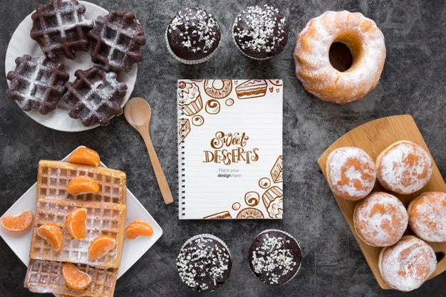 Top View Of Assortment Of Desserts With Fruit And Notebook Psd