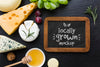 Top View Of Assortment Of Locally Grown Cheese With Blackboard Mock-Up Psd