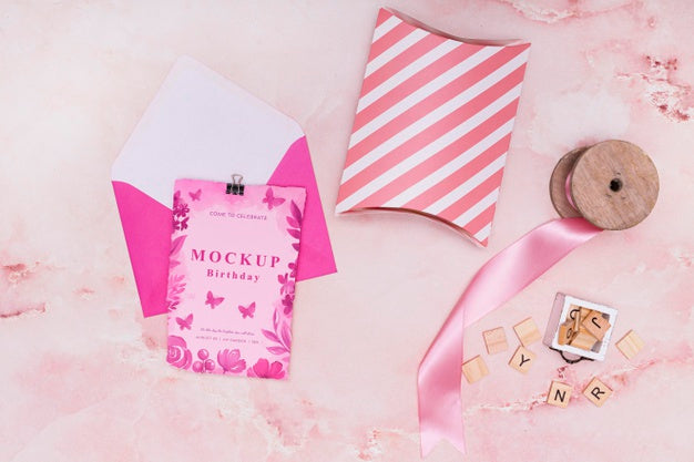 Top View Of Birthday Gift Mock-Up With Card And Envelope Psd