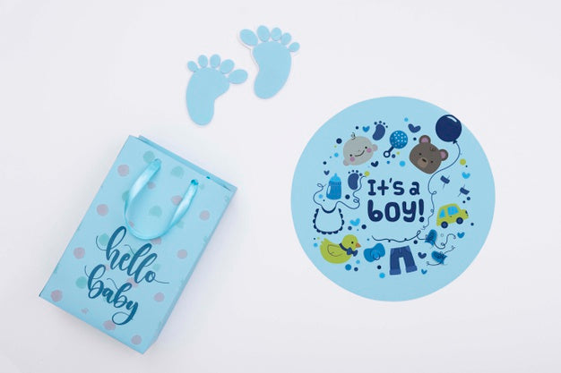 Top View Of Blue Baby Shower Decor With Gift Bag Psd