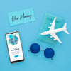 Top View Of Blue Monday Airplane With Smartphone And Sunglasses Psd