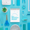 Top View Of Blue Monday Notebook With Stationery And Plant Psd