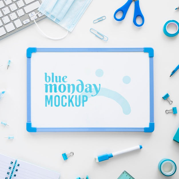 Top View Of Blue Monday Whiteboard With Scissors And Stationery Psd