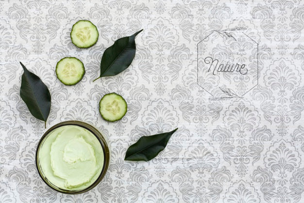 Top View Of Body Butter And Cucumber On Plain Background Mock-Up Psd