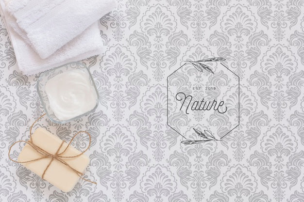 Top View Of Body Butter And Soap In Plain Background Mock-Up Psd