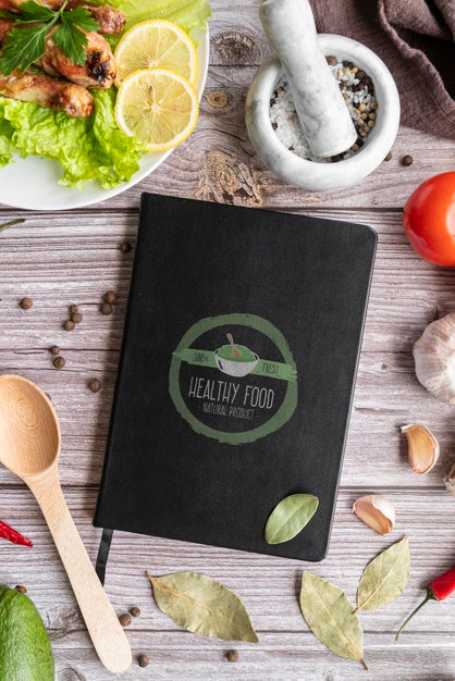 Top View Of Book With Ingredients Psd