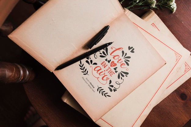 Top View Of Books On Chair With Pen Psd