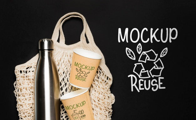 Top View Of Bottle With Paper Cups And Reusable Bag Psd