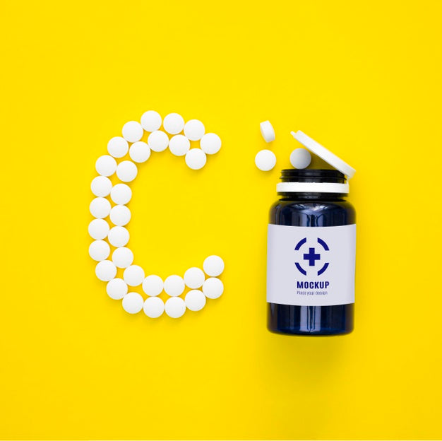 Top View Of Bottle With Pills In Shape Of C Psd