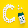 Top View Of Bottle With Pills In Shape Of C Psd